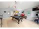 Large game room with a black billiards table, bar, and seating area at 4098 Kiser Cove Ln, Terrell, NC 28682
