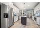 Bright, updated kitchen features stainless steel appliances, white cabinets, and a center island at 4098 Kiser Cove Ln, Terrell, NC 28682