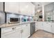 Updated kitchen featuring white cabinets, granite counters, stainless steel appliances, and tiled backsplash at 4098 Kiser Cove Ln, Terrell, NC 28682