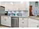 Updated kitchen featuring stainless steel appliances, white cabinets, and granite countertops at 4098 Kiser Cove Ln, Terrell, NC 28682