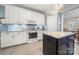 Modern kitchen with white cabinets, stainless steel appliances, and a center island at 4098 Kiser Cove Ln, Terrell, NC 28682