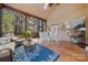 Large screened-in porch with comfortable seating and a large table at 4098 Kiser Cove Ln, Terrell, NC 28682