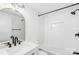 Charming white bathroom featuring an arched mirror and shower/tub combo at 4375 Creek Ave, Midland, NC 28107
