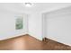Bedroom featuring wood floors, closet, and natural light at 4375 Creek Ave, Midland, NC 28107