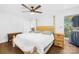 Spacious bedroom with ceiling fan, ample light, and wood floors at 4375 Creek Ave, Midland, NC 28107