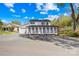 Beautiful two story home with white siding, black shutters, and black roof with mature landscaping at 4375 Creek Ave, Midland, NC 28107