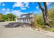 Beautiful two story home with white siding, black shutters, and black roof with mature landscaping at 4375 Creek Ave, Midland, NC 28107