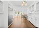 Open kitchen with large island, stainless steel refrigerator, and views to the sunroom at 4375 Creek Ave, Midland, NC 28107