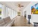 Expansive sunroom featuring wood-look floors, plenty of natural light, and a comfortable sofa at 4375 Creek Ave, Midland, NC 28107