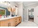 Modern bathroom boasts a double vanity, stylish mirrors, and elegant marble flooring at 4511 Morning Dove Ct, Denver, NC 28037