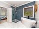 Bathroom with freestanding tub, tiled shower, and stylish tile flooring at 4511 Morning Dove Ct, Denver, NC 28037