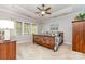 Tranquil bedroom with a tray ceiling, comfortable bed, and wood furniture creating a cozy and inviting retreat at 4511 Morning Dove Ct, Denver, NC 28037