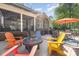 Spacious deck features a fire pit, dining table, and comfortable seating, ideal for outdoor gatherings at 4511 Morning Dove Ct, Denver, NC 28037