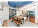 Dining room with wooden table, chairs, bench, and blue ceiling at 4511 Morning Dove Ct, Denver, NC 28037