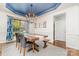 Dining room with wooden table, chairs, bench, and blue ceiling at 4511 Morning Dove Ct, Denver, NC 28037