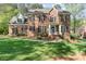 Beautiful brick home with manicured lawn, black shutters, and a welcoming front entrance at 4511 Morning Dove Ct, Denver, NC 28037