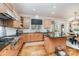 Spacious kitchen features wood cabinets, granite counters, and stainless steel appliances, ideal for cooking and gathering at 4511 Morning Dove Ct, Denver, NC 28037