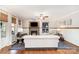 Cozy living room with fireplace, hardwood floors, and modern decor at 4511 Morning Dove Ct, Denver, NC 28037