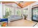 Bright sunroom with vaulted wood ceiling and large windows, offering a serene space with views of the surrounding landscape at 4511 Morning Dove Ct, Denver, NC 28037