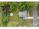 Aerial view of a well-maintained property featuring a lush green lawn and a cozy firepit area at 481 Union Cemetery Sw Rd, Concord, NC 28027