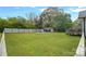 This backyard area features a large lawn and an area for entertaining with a fire pit at 481 Union Cemetery Sw Rd, Concord, NC 28027