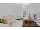 This neutral Bedroom includes a crib, changing table, rocking chair, and an abundance of toys at 481 Union Cemetery Sw Rd, Concord, NC 28027