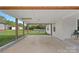 Spacious carport with sturdy wooden posts and a concrete floor, perfect for parking and outdoor projects at 481 Union Cemetery Sw Rd, Concord, NC 28027