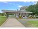 Charming home features a welcoming porch, carport, and beautifully landscaped yard at 481 Union Cemetery Sw Rd, Concord, NC 28027