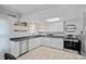 Functional kitchen with white cabinets and stainless steel appliances at 481 Union Cemetery Sw Rd, Concord, NC 28027