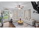 Cozy living room featuring a large sectional sofa and natural light at 481 Union Cemetery Sw Rd, Concord, NC 28027