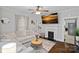 Comfortable living room with fireplace, TV, and stylish decor at 481 Union Cemetery Sw Rd, Concord, NC 28027