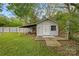 Backyard shed with wooden deck and overhanging roof at 481 Union Cemetery Sw Rd, Concord, NC 28027