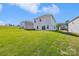 Expansive backyard with a lush lawn, and a view of the house's siding and sliding glass doors at 5016 Poplin Vly, Cherryville, NC 28021
