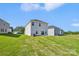 Spacious backyard of the house, with sliding glass doors and newly installed sod at 5016 Poplin Vly, Cherryville, NC 28021