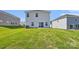 The backyard features a lush lawn, sliding glass doors, and newly installed sod at 5016 Poplin Vly, Cherryville, NC 28021