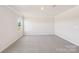 A spacious bedroom with neutral walls, carpet, and bright natural light at 5016 Poplin Vly, Cherryville, NC 28021