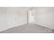 Bedroom with doors to other rooms, with carpet flooring at 5016 Poplin Vly, Cherryville, NC 28021