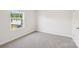 Bedroom with a window for natural light, and neutral colored carpet at 5016 Poplin Vly, Cherryville, NC 28021