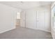 Comfortable bedroom with gray carpet, white trim, and a door to another room at 5016 Poplin Vly, Cherryville, NC 28021
