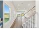 Bright and airy entryway featuring hardwood floors, stairs with carpet and large window at 5016 Poplin Vly, Cherryville, NC 28021
