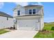 A bright two-story home with attached garage and concrete driveway at 5016 Poplin Vly, Cherryville, NC 28021