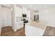 Bright, modern kitchen with white cabinets, stainless steel appliances, and a granite countertop island, perfect for cooking at 5016 Poplin Vly, Cherryville, NC 28021