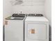 Convenient laundry area featuring a new washer and dryer set and wire shelving at 5016 Poplin Vly, Cherryville, NC 28021