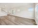 Bright living room with hardwood floors, white walls, and multiple windows, creating a spacious and airy atmosphere at 5016 Poplin Vly, Cherryville, NC 28021