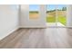 Bright living room with hardwood floors, white walls, and large sliding glass doors that let in plenty of natural light at 5016 Poplin Vly, Cherryville, NC 28021