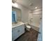 Well-lit bathroom with vanity, toilet, and bathtub with shower at 5100 Verona Rd # 96, Charlotte, NC 28213