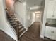 Welcoming hallway and staircase with hardwood floors and modern accents at 5100 Verona Rd # 96, Charlotte, NC 28213