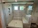 Beautiful bathroom with glass shower, marble tile, and a shower seat at 5100 Verona Rd # 96, Charlotte, NC 28213