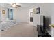 Inviting bedroom with neutral carpet, a king bed, a ceiling fan and a view to the bathroom at 512 Red Oak Ct, Tega Cay, SC 29708