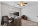 Bright home office featuring a wood desk, neutral walls, and a ceiling fan with a light at 512 Red Oak Ct, Tega Cay, SC 29708